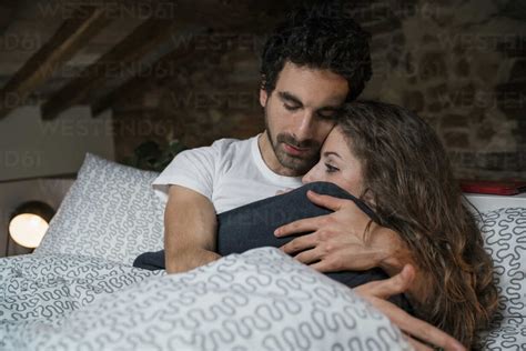 Couple Hug On Bed